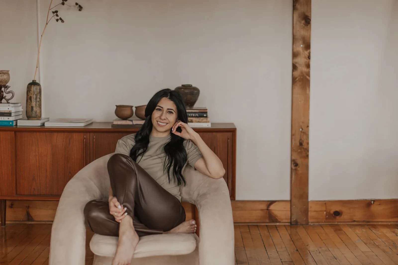 Dr. Monica Velletri, ND, founder of JOSIE, smiling in her warmly styled studio